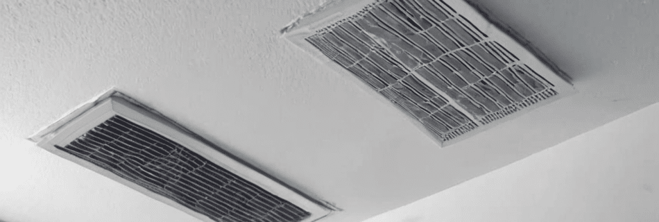 How regular AC duct cleaning in Dubai helps in mold removal - professional technician inspecting HVAC duct interior for mold contamination in Dubai villa